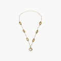 14K gold plated necklace with organic leaf motifs and freshwater pearls arranged in an elegant chain design on neutral background.