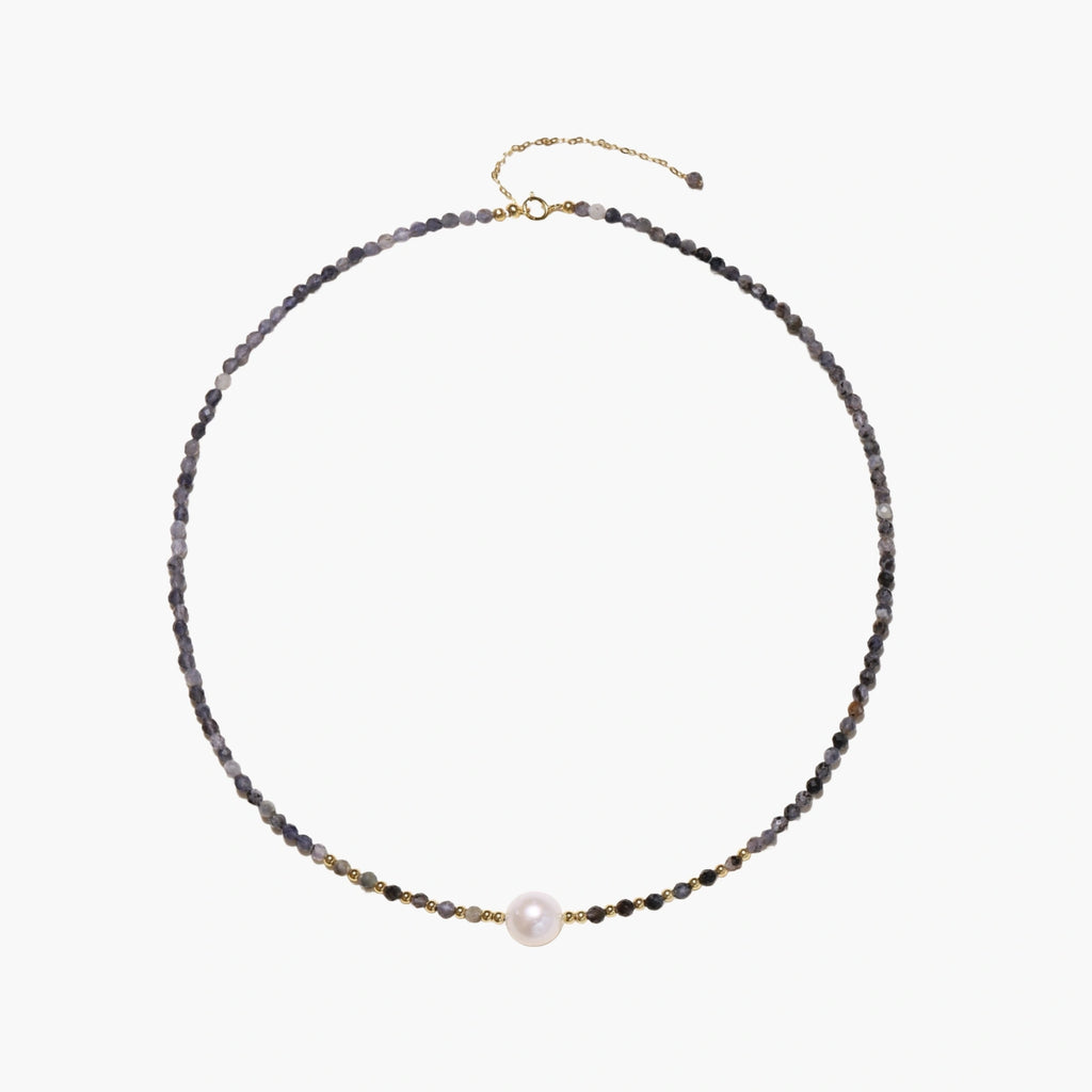 Dainty necklace with faceted purple iolite beads, gold vermeil accents, and central pink-white freshwater pearl.