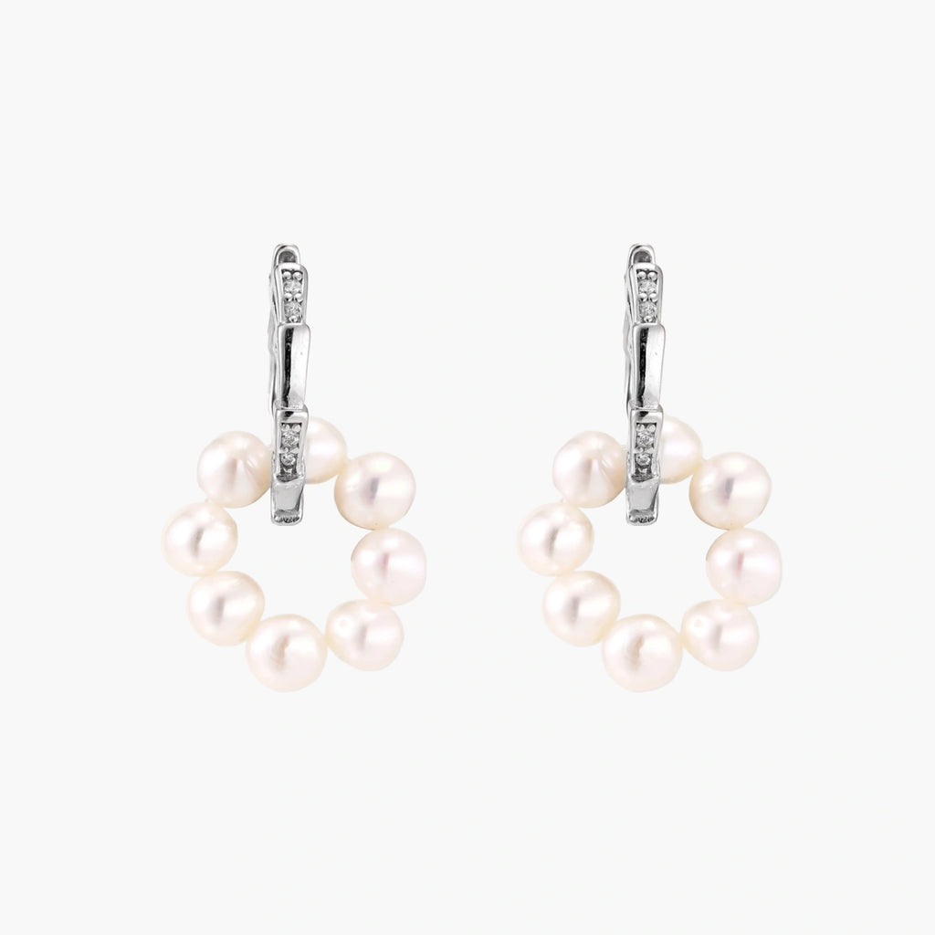 Rhodium-plated silver hoop earrings with freshwater pearls arranged in crescent formation and diamond accents