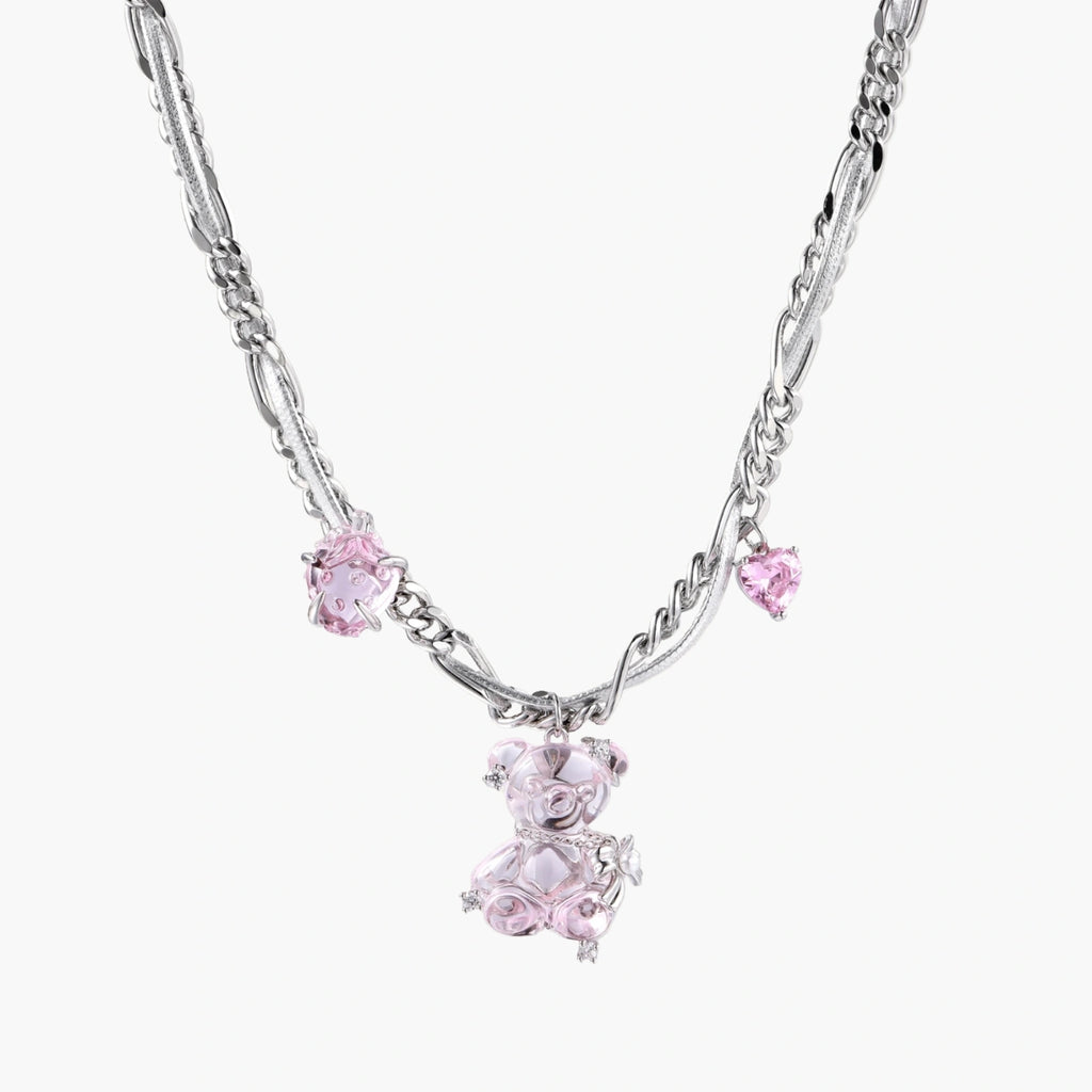 Silver twisted chain necklace with fairy tale carriage pendant adorned with pink cubic zirconia gemstones