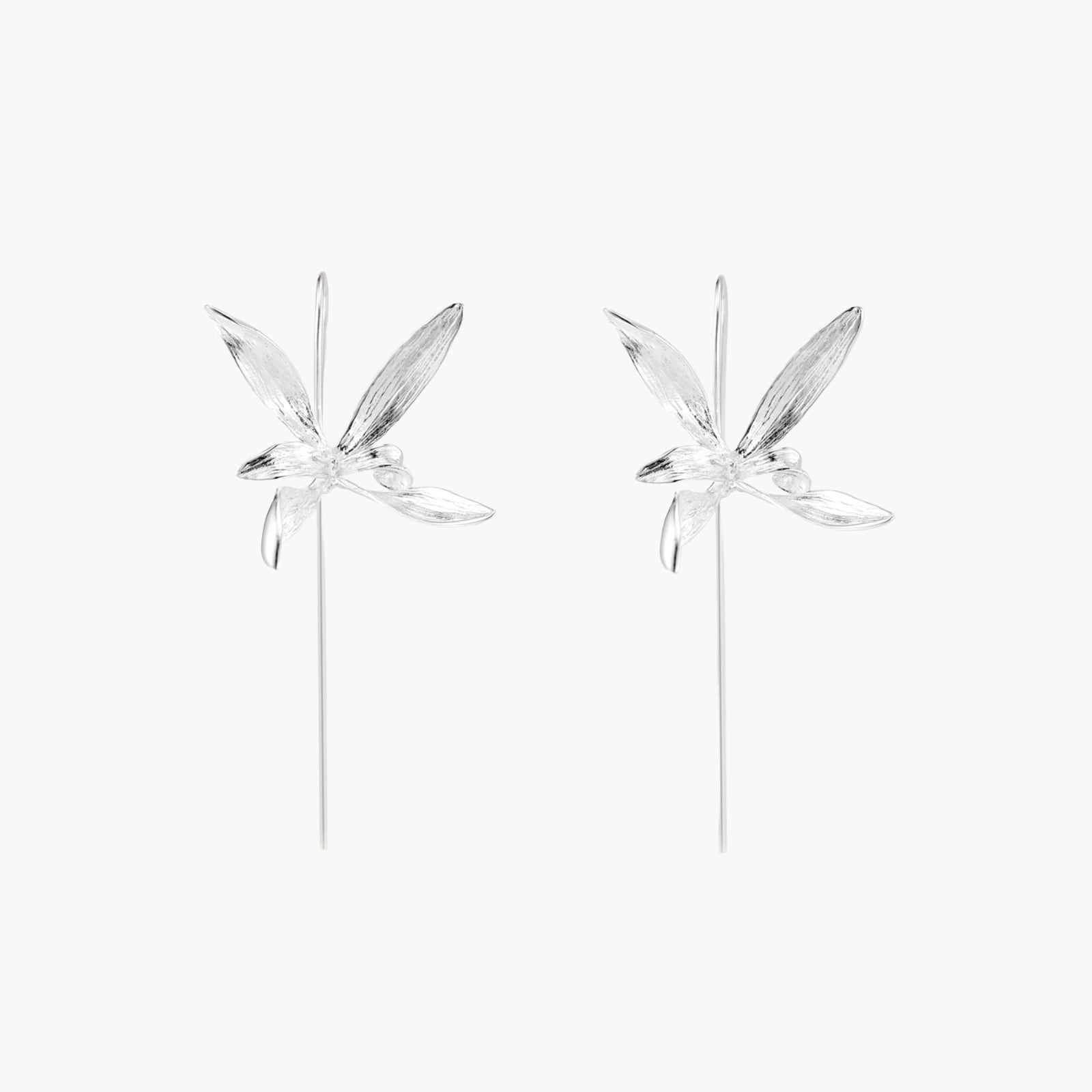 Delicate sterling silver dragonfly earrings with textured wings and curved threader hooks on white background