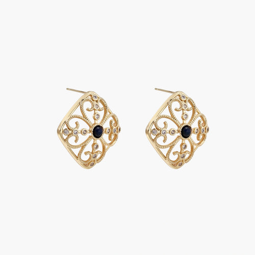 Gold filigree stud earrings with navy lapis lazuli center stone and mother-of-pearl accents in ornate quatrefoil design
