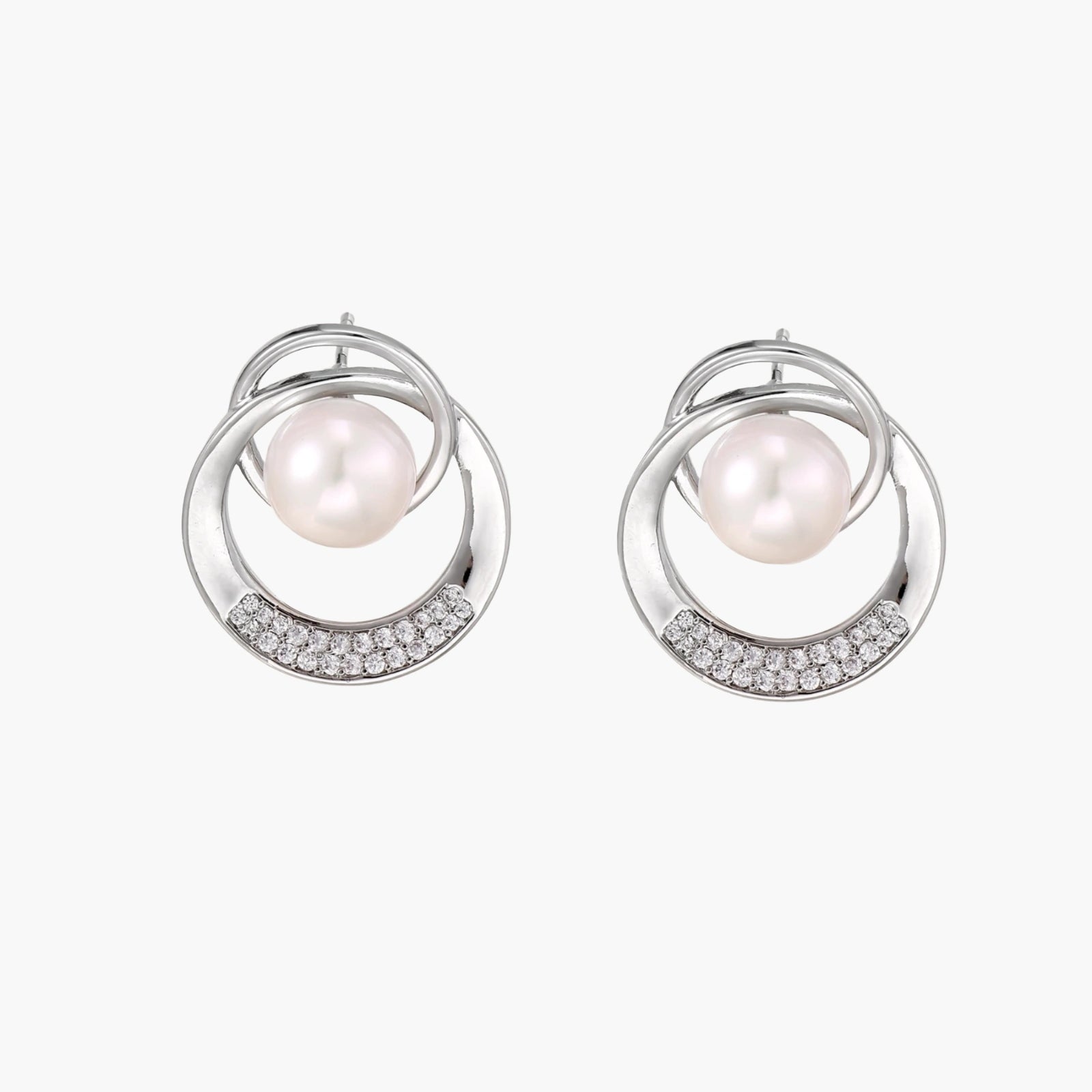 White gold-plated brass earrings with circular design, freshwater pearl center, and diamond accents