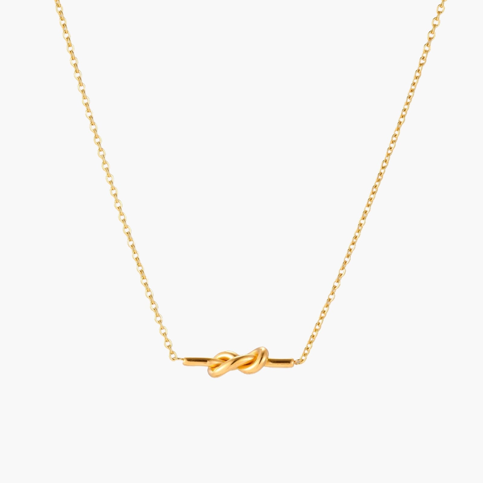 Dainty 18K gold plated necklace with infinity knot pendant on delicate chain against white background