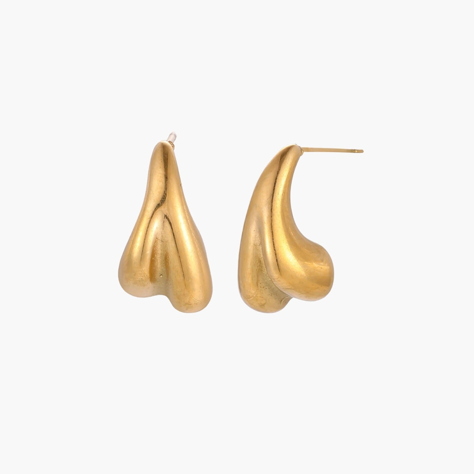 Organic sculptural gold stud earrings with fluid matte finish on cream background