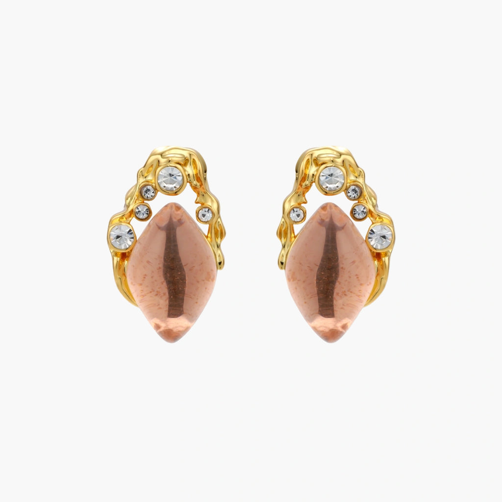 Gold-plated baroque stud earrings with coral-pink liuli stones and cubic zirconia crystals on white background.