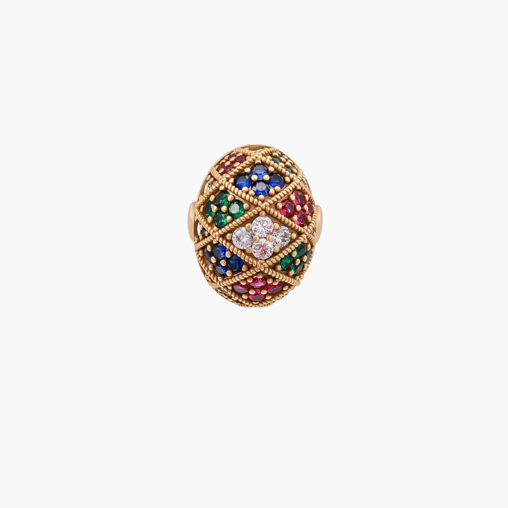 Oversized gold ring with geometric mosaic pattern featuring multicolor zirconia stones in ruby, emerald, sapphire, and clear tones.