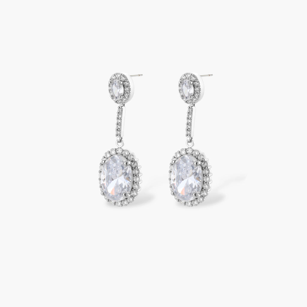 Elegant white gold plated jewelry set with oval cubic zirconia stones in halo settings, featuring Y-necklace and drop earrings.